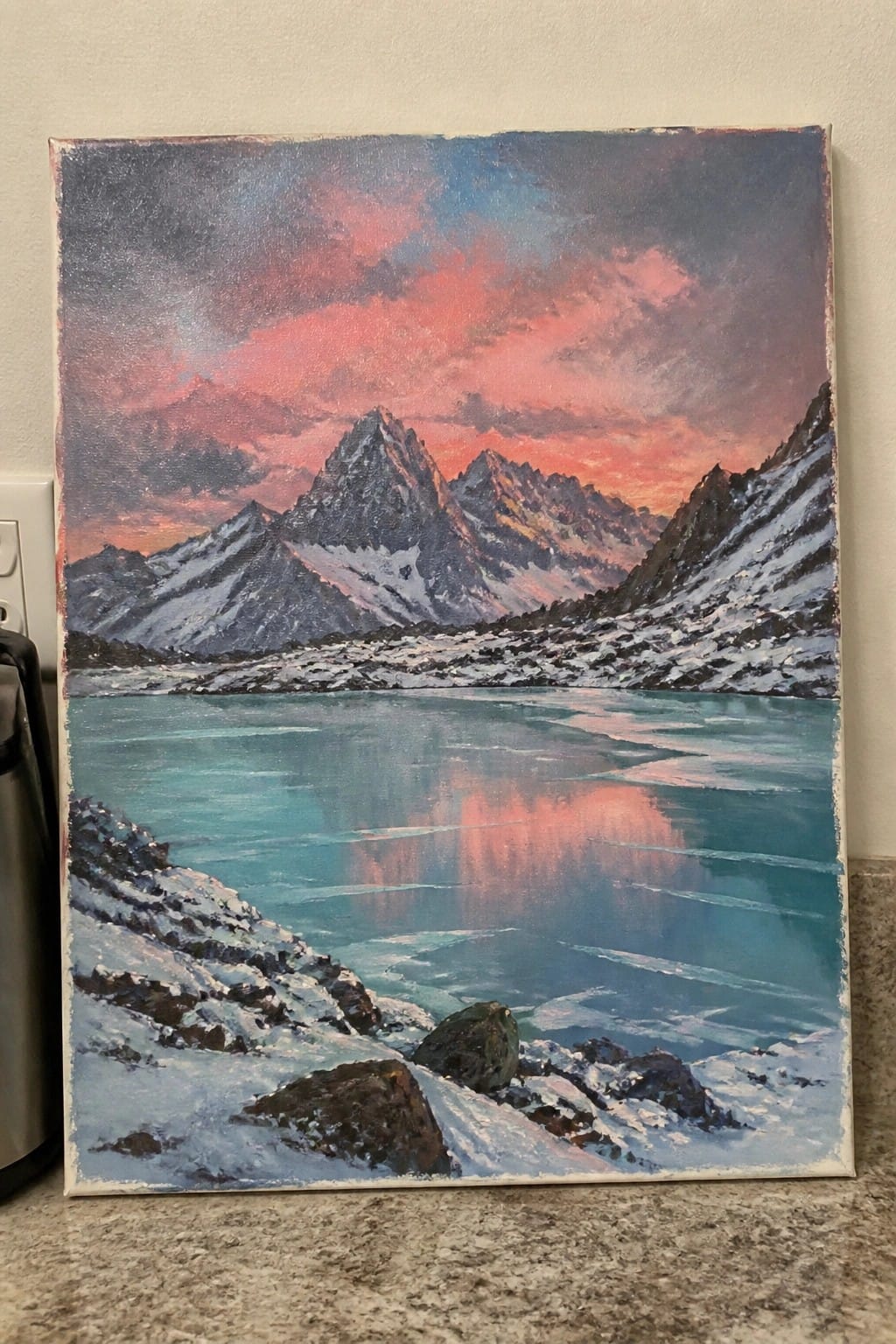 Vibrant painting of snow-capped mountains reflected in a turquoise icy lake at sunset.