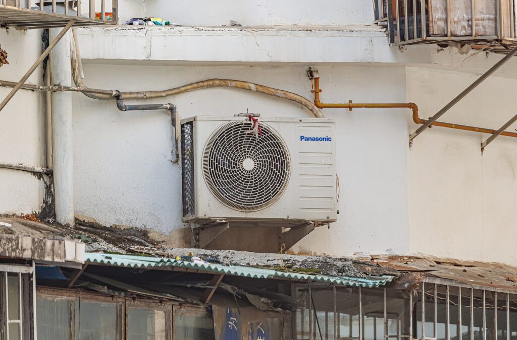 Residential outdoor Panasonic air conditioner condenser for pre-summer cooling prep